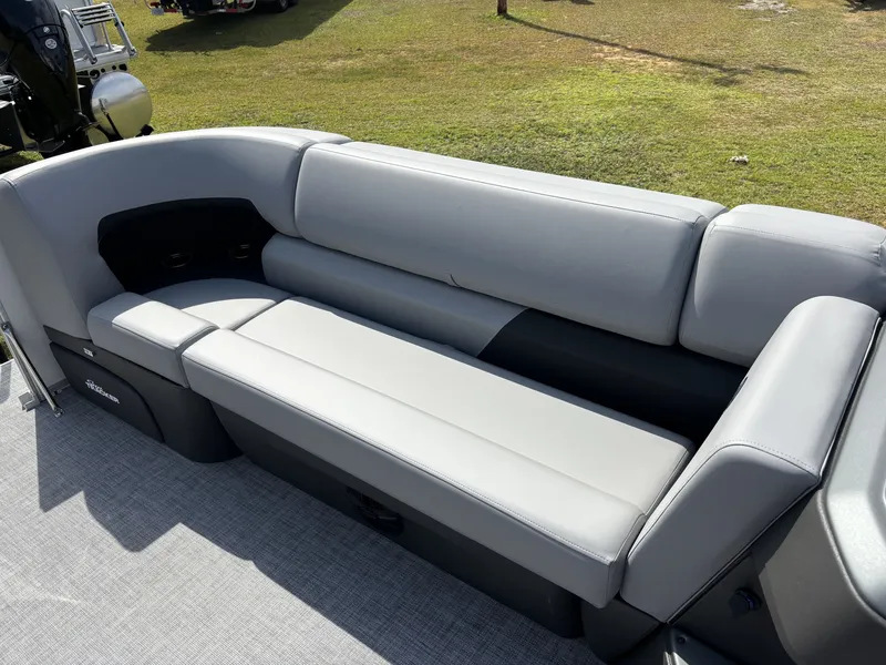 Slide: The Image of The image shows a gray seating area on a 2026 Sun Tracker Party Barge 20 DLX. - 15