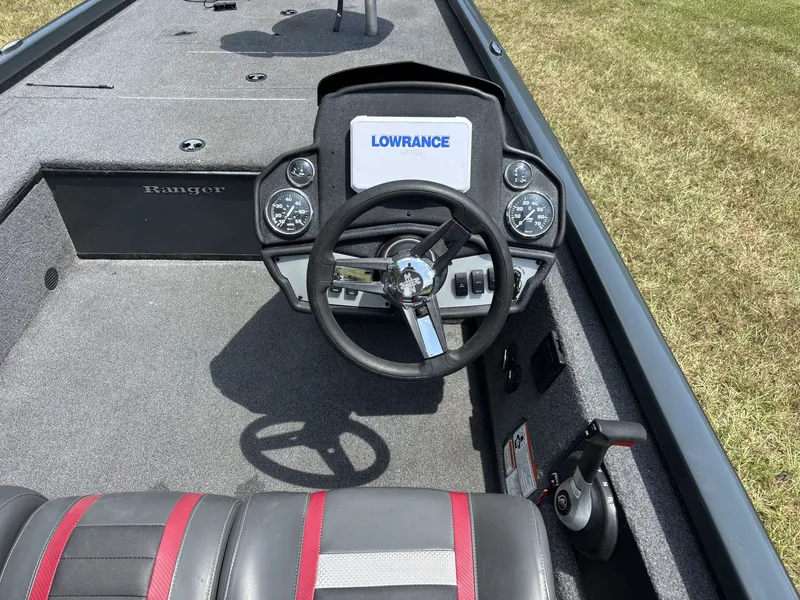 Slide: The Image of The image shows the cockpit of a 2025 Ranger RT RT188C boat with a Lowrance display. - 14