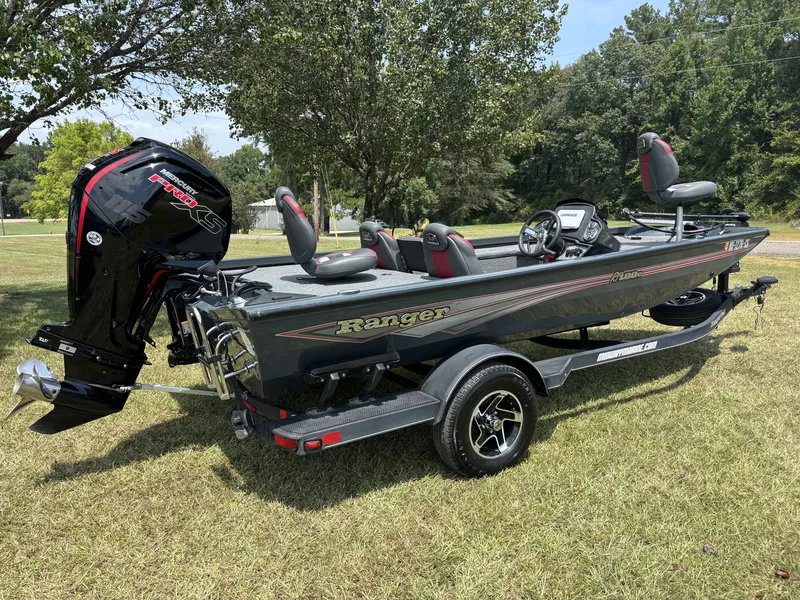 Slide: The Image of A gray Ranger boat, model RT188C, sits on a trailer on a grassy area. - 3