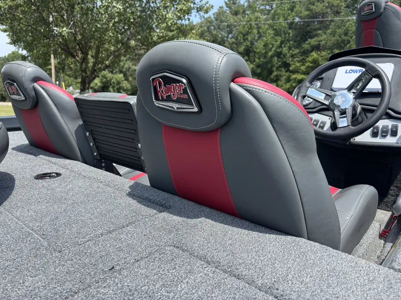 Slide: The Image of The image shows the seats of a 2025 Ranger RT RT188C boat with gray and red upholstery. - 9