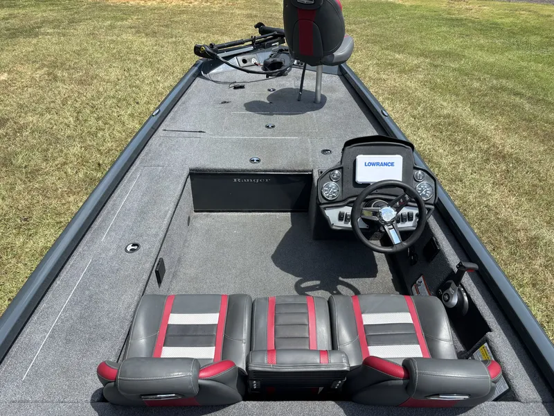 Slide: The Image of The image shows a 2025 Ranger RT RT188C boat with gray and red seats and a helm station. - 11