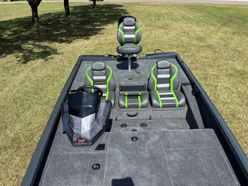 Slide: The Image of The image shows a Ranger RT198P boat with gray and green seats on a grassy area. - 17