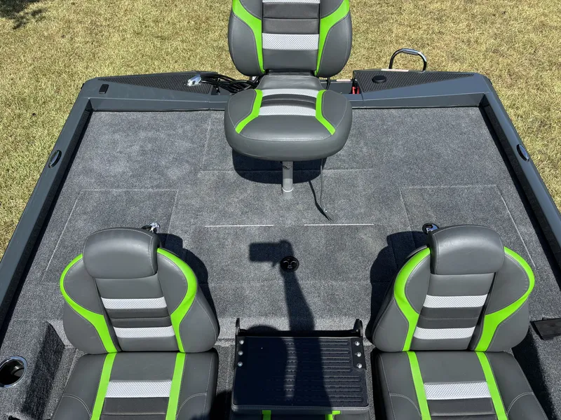 Slide: The Image of The image shows the cockpit of a 2027 Ranger RT RT198P boat with gray and green seats. - 19