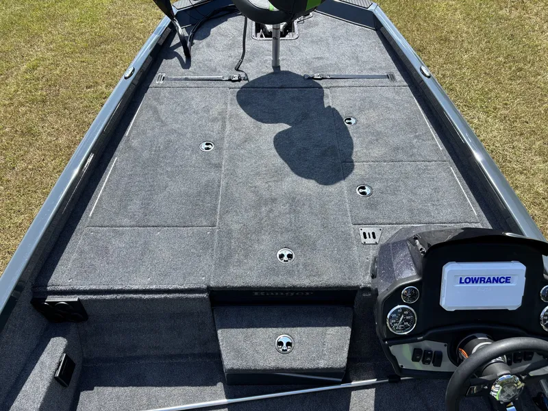 Slide: The Image of The image shows the deck of a 2027 Ranger RT RT198P boat with gray carpeting and a Lowrance screen. - 14