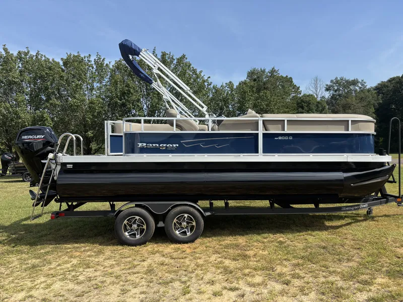 The Image of 2025 Ranger REATA CLASSIC SERIES 200C on a trailer, featuring a blue and white design. - 1