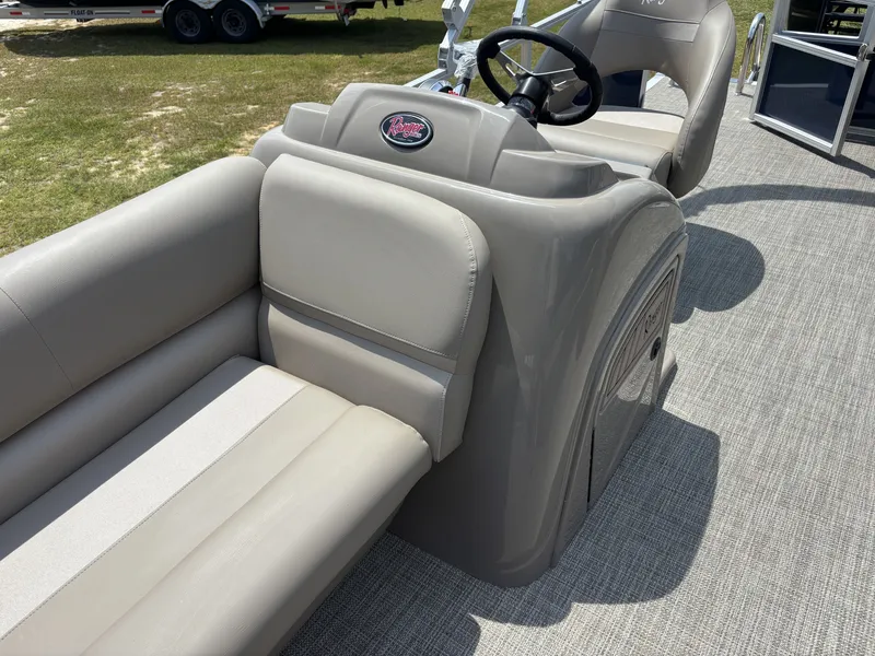 Slide: The Image of The image shows the cockpit of a 2025 Ranger REATA CLASSIC SERIES 200C with beige seating. - 14