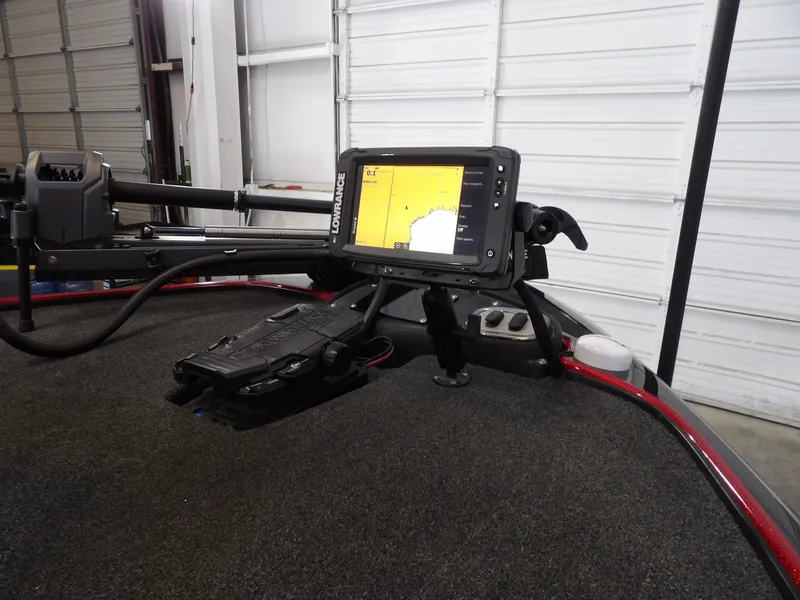 Slide: The Image of A 2010 Nitro Z-7 with a modern fish finder on the deck, parked in a garage. - 22