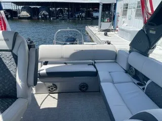 Slide: The Image of The image shows the interior of a 2022 Harris Grand Mariner 250 with gray upholstery. - 21