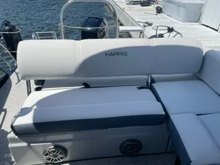 Slide: The Image of The image shows the stern of a 2022 Harris Grand Mariner 250 with comfortable seating. - 14