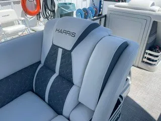 Slide: The Image of The image shows a luxurious seat on a Harris Grand Mariner 250 boat. - 17