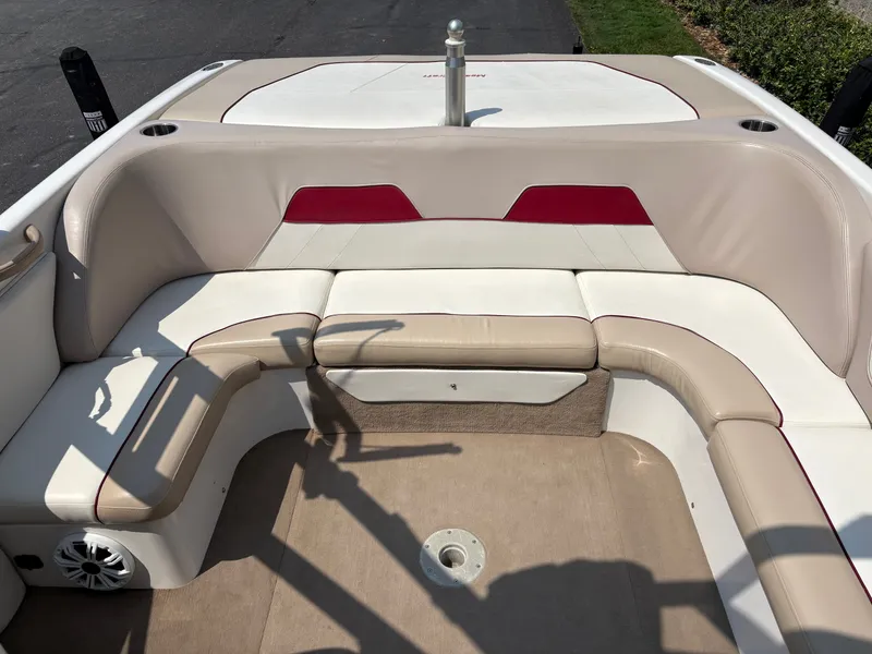 Slide: The Image of The image shows the cockpit of a 2000 MasterCraft 230 VRS with beige and red seating. - 15