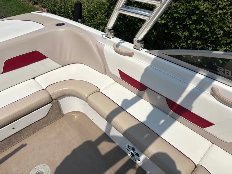 Slide: The Image of The image shows the interior design of a 2000 MasterCraft 230 VRS with beige and red accents. - 14