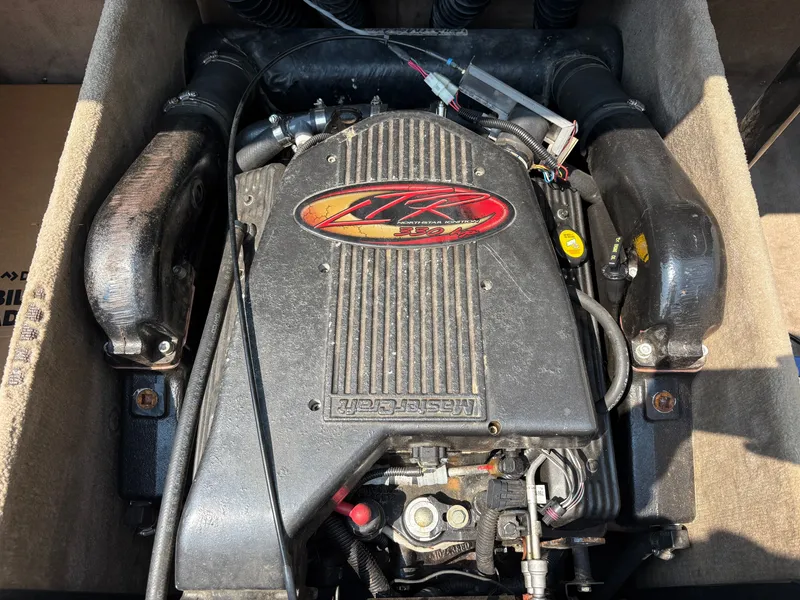 Slide: The Image of An engine compartment featuring a 2000 MasterCraft 230 VRS engine, clean and well-maintained. - 17
