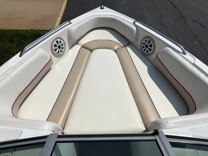 Slide: The Image of The image shows the bow of a 2000 MasterCraft 230 VRS with beige and white upholstery. - 16