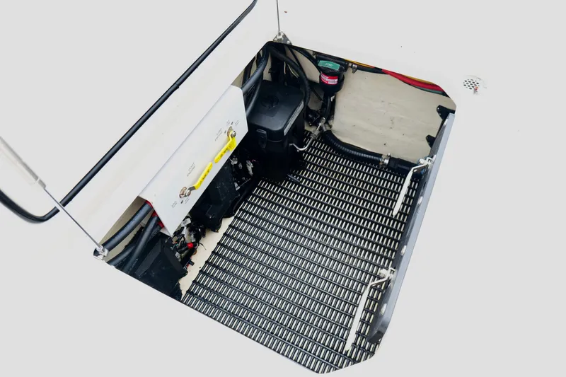 Slide: The Image of Engine compartment of 2025 Fountain 34 Tournament Edition boat, showcasing battery and wiring. - 26