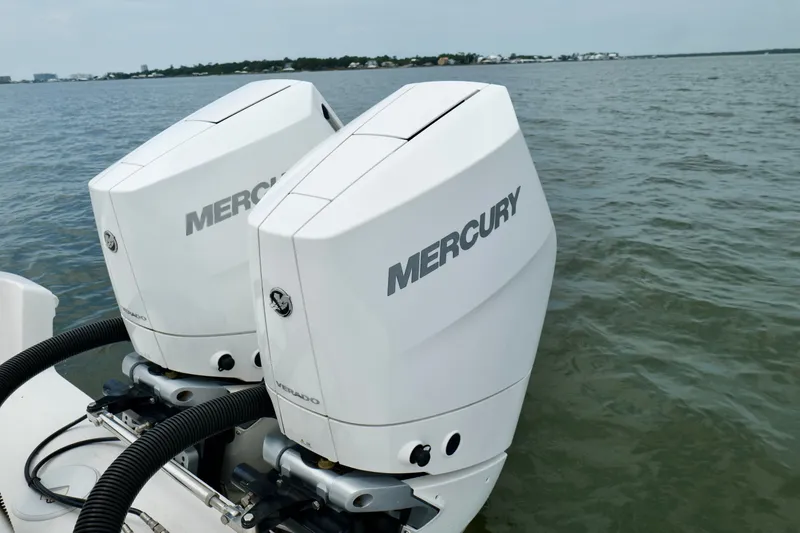 Slide: The Image of Twin Mercury Verado engines on a 2025 Fountain 34 Tournament Edition boat. - 22