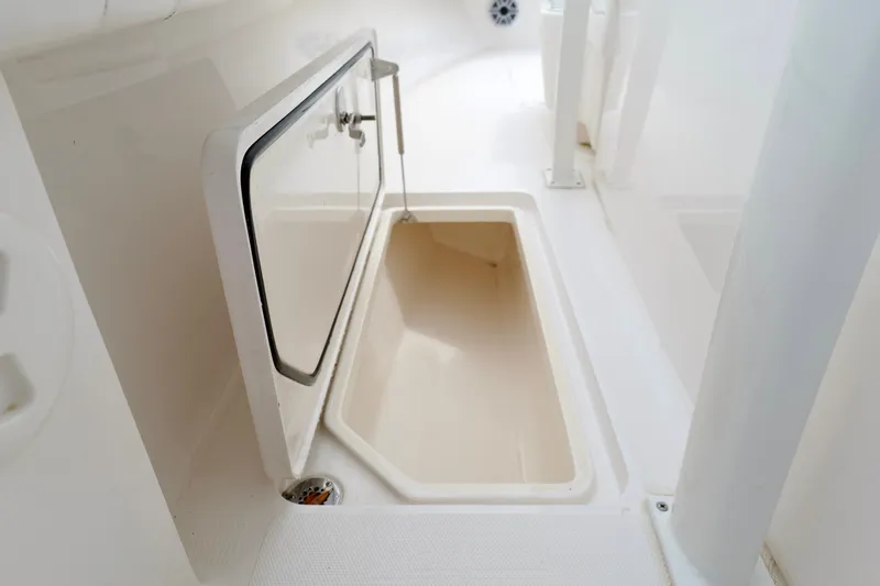 Slide: The Image of 2025 Fountain 34 Tournament Edition boat storage compartment, open and empty. - 29