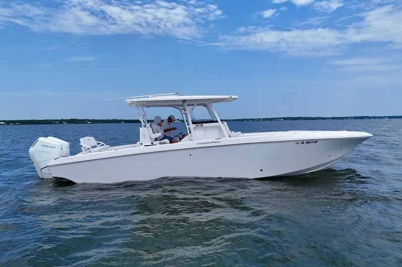 The Image of 2025 Fountain 34 Tournament Edition boat cruising on open water under a clear sky. - 0