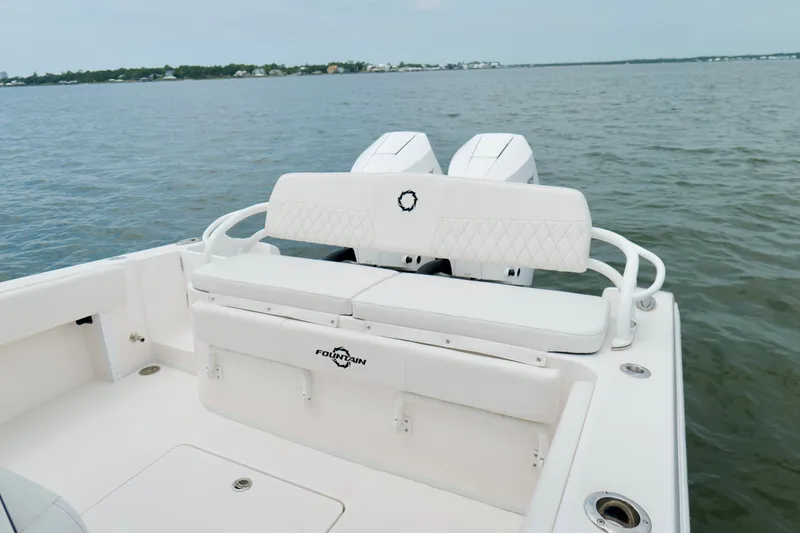 Slide: The Image of 2025 Fountain 34 Tournament Edition boat with dual engines on calm water. - 19