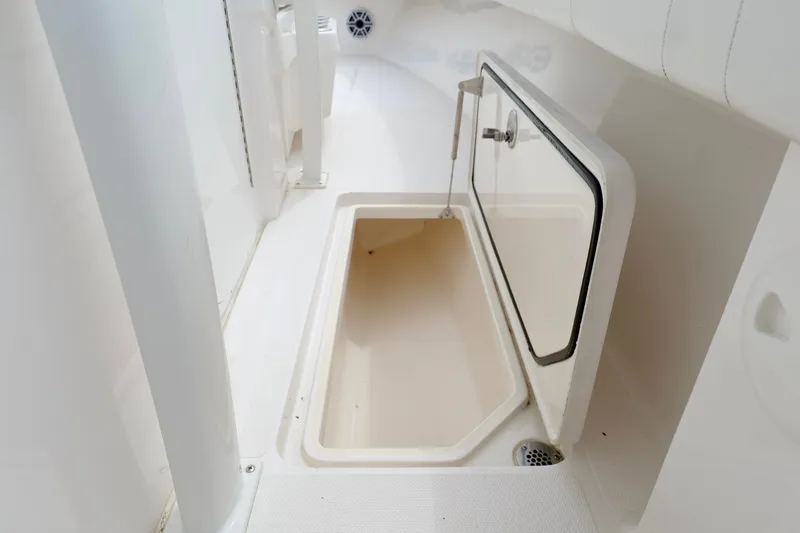 Slide: The Image of Open storage compartment on 2025 Fountain 34 Tournament Edition boat. - 30
