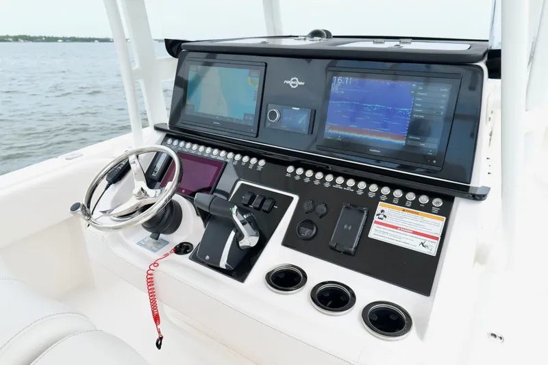 Slide: The Image of Control panel of 2025 Fountain 34 Tournament Edition boat with advanced navigation displays. - 14