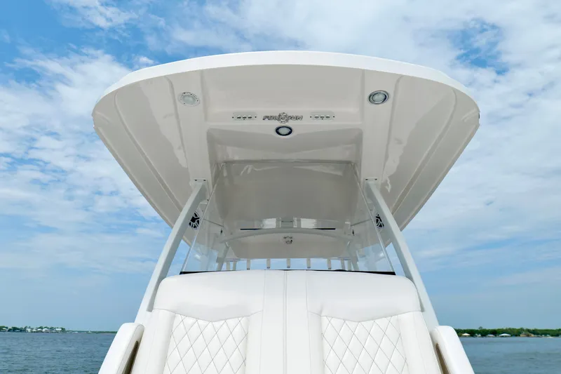 Slide: The Image of 2025 Fountain 34 Tournament Edition boat, featuring sleek design and luxurious seating under a clear sky. - 36