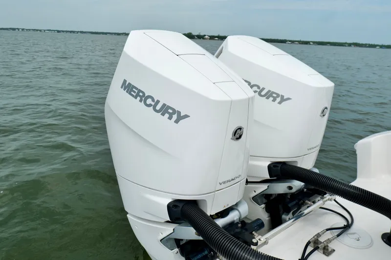Slide: The Image of Twin Mercury Verado engines on a 2025 Fountain 34 Tournament Edition boat. - 21