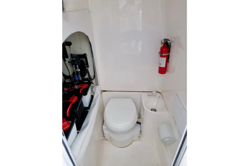 Slide: The Image of Interior of 2025 Fountain 34 Tournament Edition boat with toilet and fire extinguisher. - 39