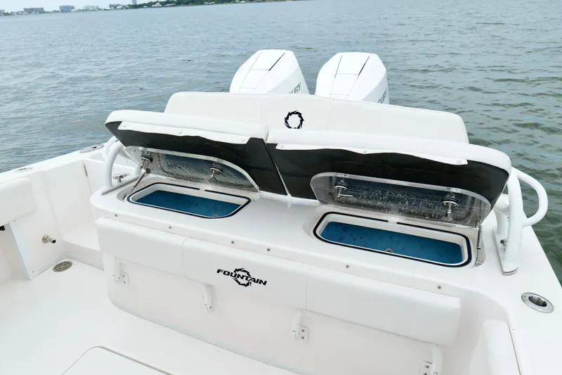 Slide: The Image of 2025 Fountain 34 Tournament Edition boat with open storage compartments on deck. - 20