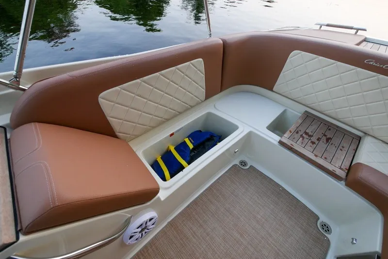 Slide: The Image of 2018 Chris-Craft Launch 27 boat interior with cushioned seating and storage compartments. - 15
