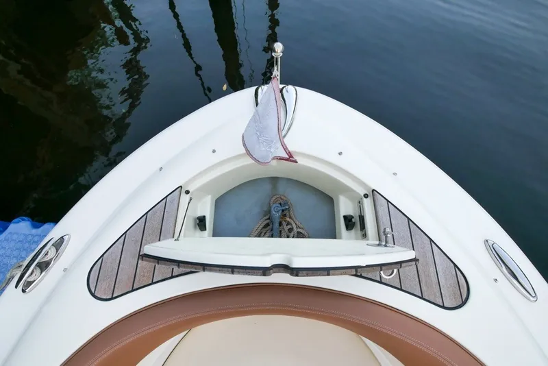 Slide: The Image of 2018 Chris-Craft Launch 27 boat bow with anchor storage and teak decking. - 33
