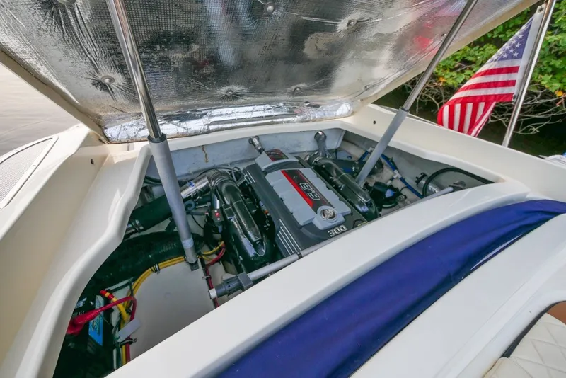 Slide: The Image of Engine compartment of a 2018 Chris-Craft Launch 27 boat, showcasing the engine details. - 11
