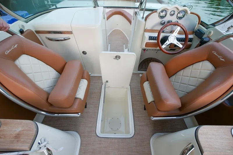 Slide: The Image of 2018 Chris-Craft Launch 27 interior with tan leather seats and classic dashboard design. - 22