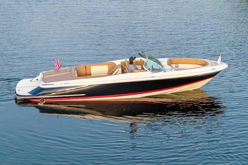 The Image of 2018 Chris-Craft Launch 27 boat cruising on calm water. - 0