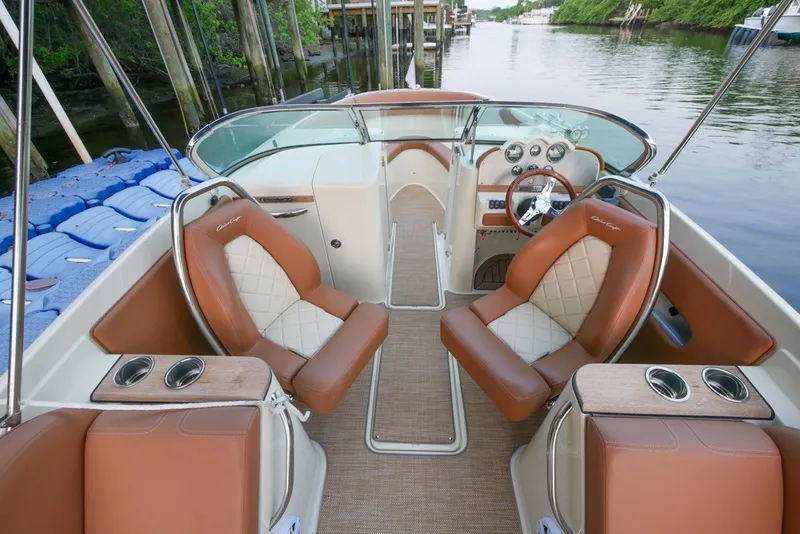 Slide: The Image of 2018 Chris-Craft Launch 27 boat interior with luxurious seating and elegant dashboard design. - 18