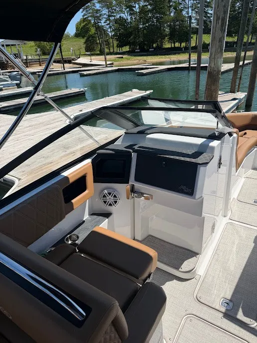 Slide: The Image of The image shows the cockpit of a 2027 Cobalt R26 boat with sleek seating and a modern dashboard. - 15
