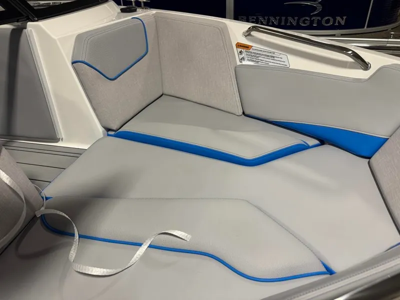 Slide: The Image of The 2025 Ski Nautique 200 Open Bow interior features gray and blue upholstery. - 11