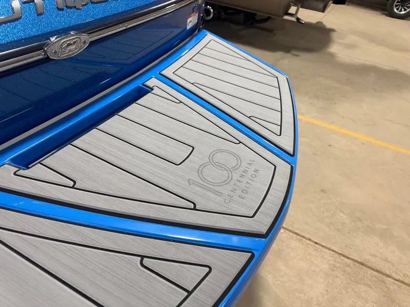 Slide: The Image of Close-up of a blue Nautique boat's stern with "Centennial Edition" lettering. - 28