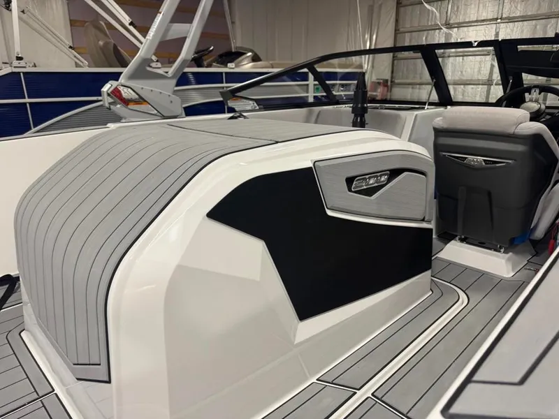 Slide: The Image of The image shows the interior of a 2025 Nautique Ski Nautique 200 Open Bow with modern seating and sleek details. - 20
