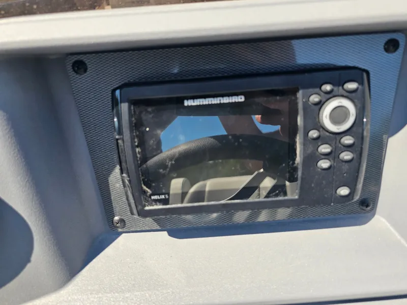 Slide: The Image of A Humminbird fish finder is integrated into the dashboard of a Sylvan boat. - 6