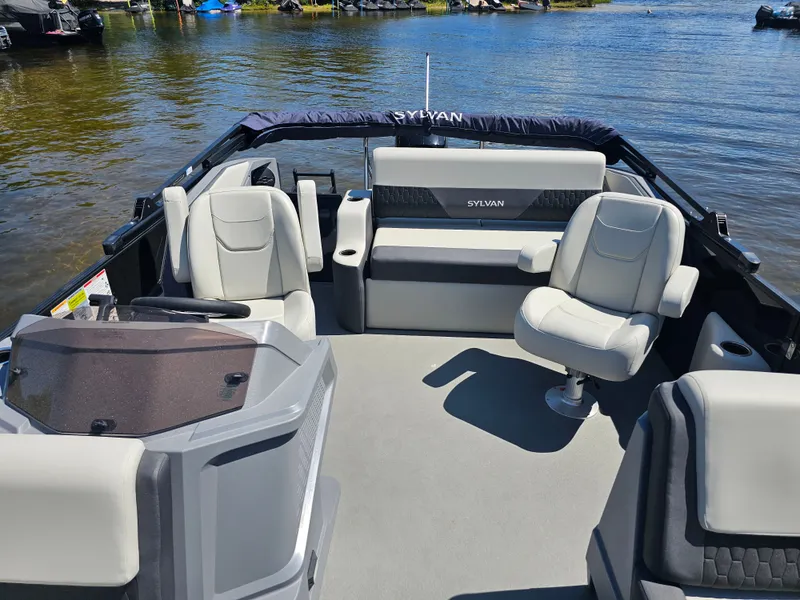 Slide: The Image of The image shows a 2026 Sylvan R-20 CLZ DH boat with modern seating and a clean deck. - 4