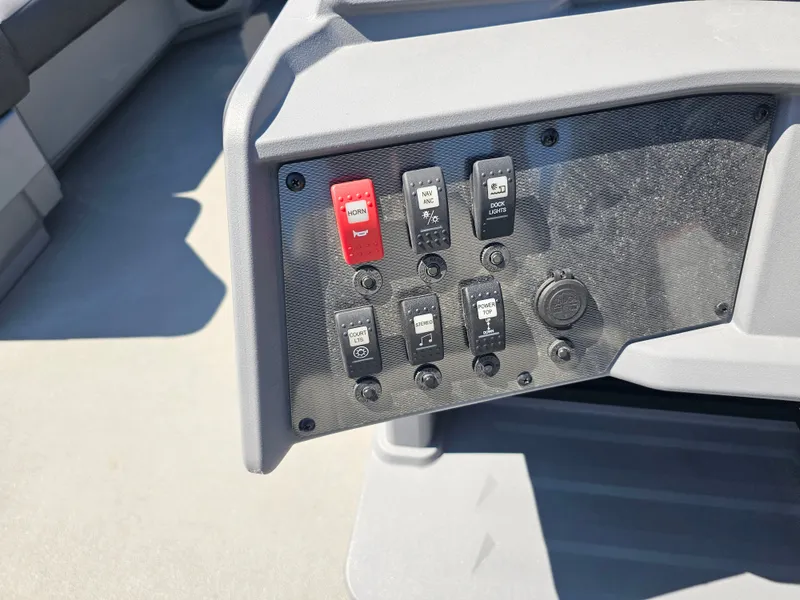 Slide: The Image of Close-up of a control panel on a 2026 Sylvan R-20 CLZ DH boat. - 7
