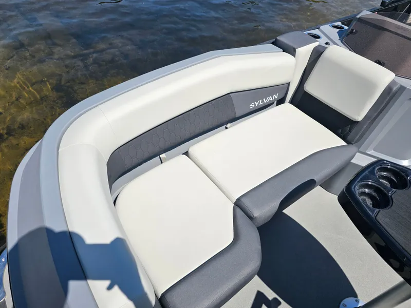 Slide: The Image of The image shows the seating area of a 2026 Sylvan R-20 CLZ DH boat with gray and white upholstery. - 3