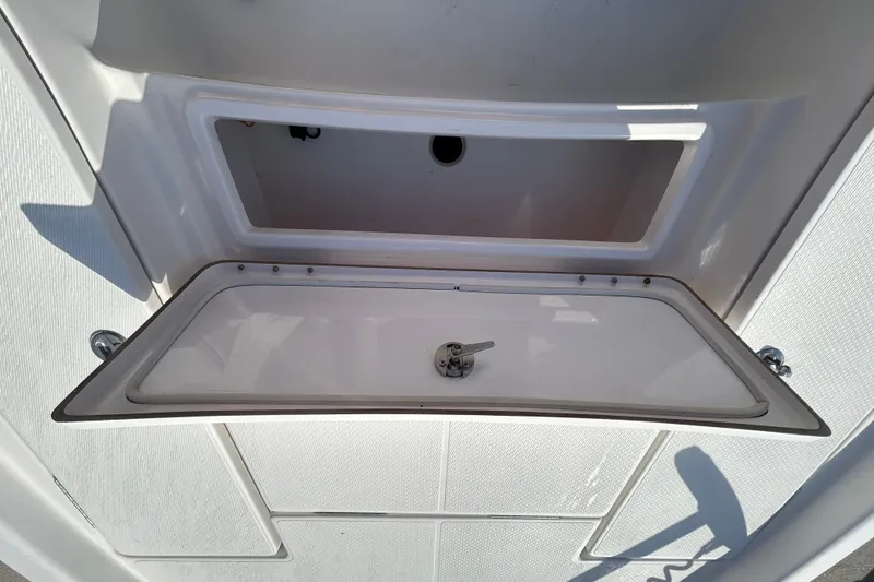 Slide: The Image of Open storage compartment on a 2016 Blue Wave 2000 PureBay boat. - 11