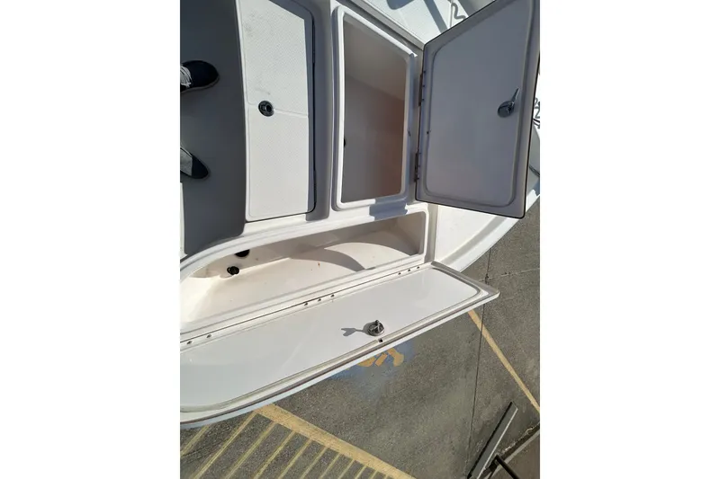 Slide: The Image of Open storage compartments on a 2016 Blue Wave 2000 PureBay boat deck. - 9