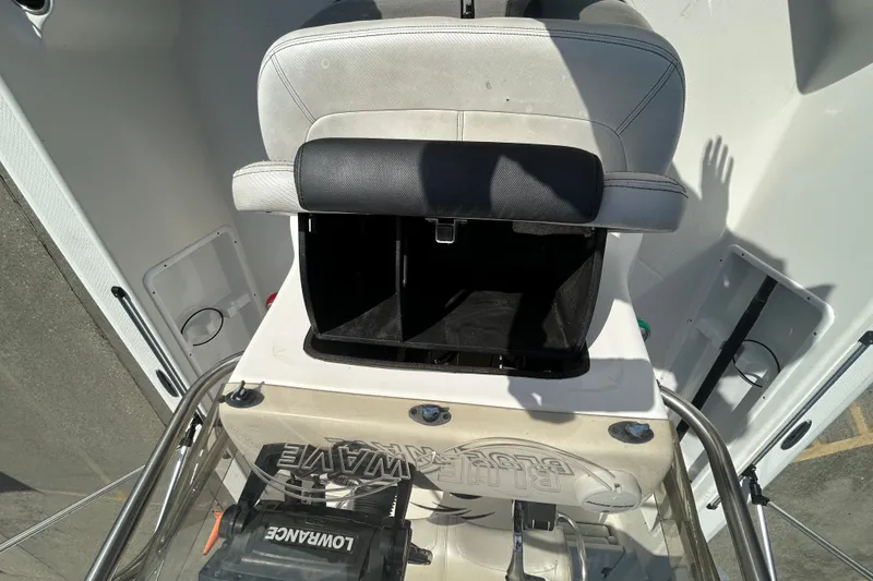 Slide: The Image of 2016 Blue Wave 2000 PureBay boat interior with seat and storage compartment. - 14