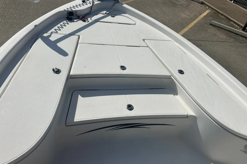 Slide: The Image of 2016 Blue Wave 2000 PureBay boat deck with storage compartments and sleek design. - 8