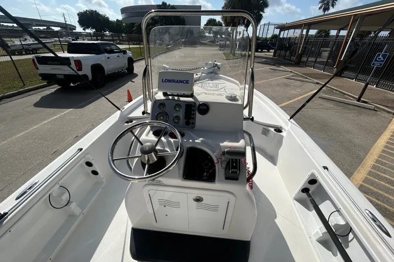 Slide: The Image of 2016 Blue Wave 2000 PureBay boat interior with steering wheel and control panel. - 6