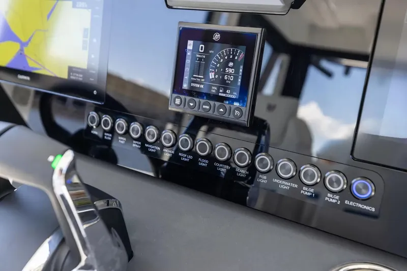 Slide: The Image of The image shows the dashboard of a Wellcraft 28 Explorer with modern instruments and switches. - 17