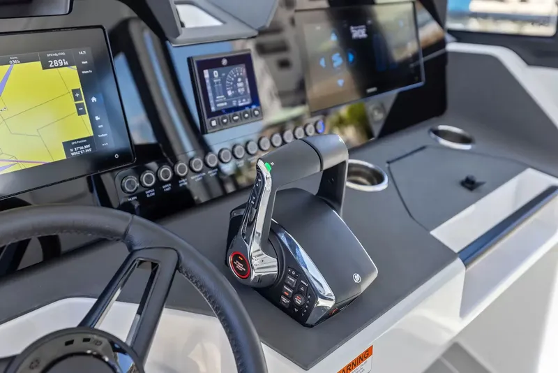 Slide: The Image of The image shows the modern cockpit of a 2027 Wellcraft 28 Explorer with high-tech controls. - 18
